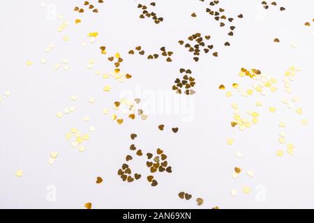 Beautiful light background with gold sequins hearts Stock Photo