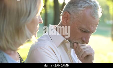 Pensive retired man thinking over life difficulties, hard life of pensioners Stock Photo