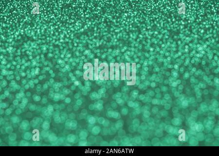 Beautiful green background of unfocused sequins and glitter Stock Photo