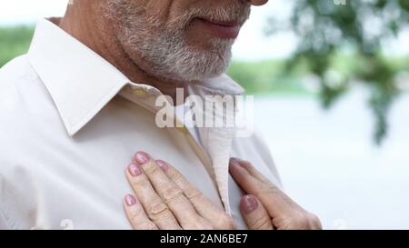 Hands of senior lady on man chest, long-awaited meeting, love relationship, care Stock Photo