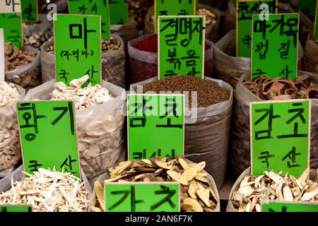 Containers of traditional Korean natural medicine, bark, roots and herbs in a street medicine market in Seoul, South Korea Stock Photo