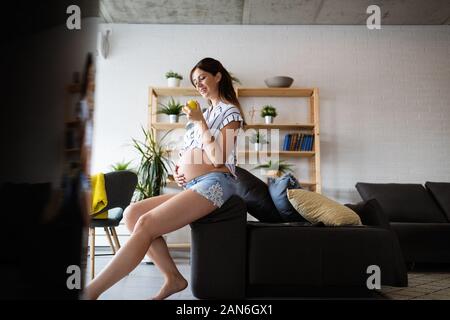 Pregnant woman expecting baby with healthy lifestyle Stock Photo