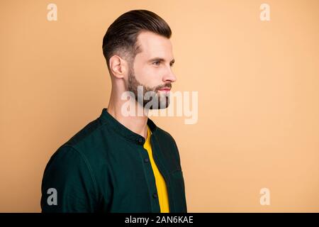 Closeup profile photo of macho guy serious looking empty space perfect neat hairstyle bristle young promoted boss chief wear casual outfit isolated Stock Photo