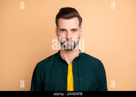 Closeup photo of amazing macho guy serious perfect appearance neat hairstyle bristle young promoted boss chief wear casual outfit isolated beige Stock Photo