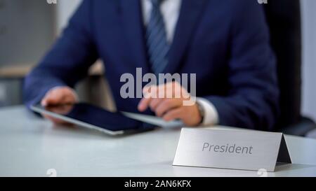 Country president working on tablet pc, preparing before public performance Stock Photo