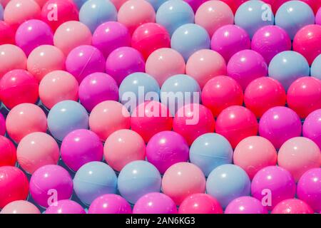 Plastic balls of various colors perfectly line up in several rows. Concept. Symbol for unity, perfection, diversity, alginment, being different. Stock Photo