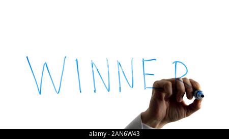 Man writing winner word on white background, sport competition, achievements Stock Photo