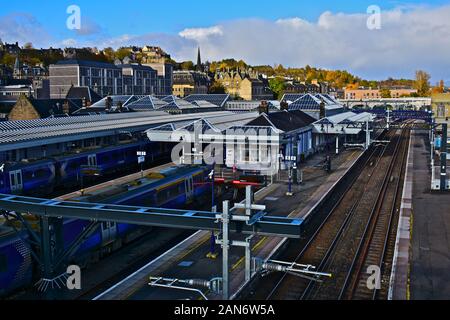 View of Stirling railway station with part of the old town in view in background.Modern trains arriving & departing. Stock Photo