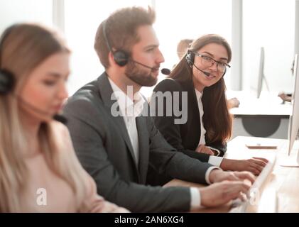 call center employees work with clients in a modern office Stock Photo