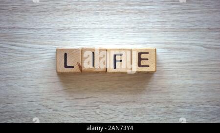 Life word made of cubes, plans for future, freedom and happiness, ambition Stock Photo