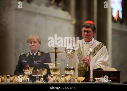 16 January 2020, North Rhine-Westphalia, Cologne: Rainer Maria Cardinal Woelki (r), Archbishop of Cologne, celebrates Holy Communion with soldiers. On the occasion of World Peace Day 2020, Cardinal Woelki celebrated with soldiers in the Domeinen International Soldiers' Service. Photo: Oliver Berg/dpa Stock Photo