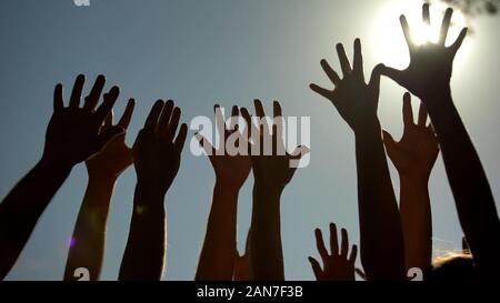 People raising hands, voting for democracy, volunteering campaign, leadership Stock Photo