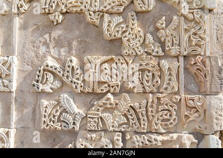 Cordoba, Spain -  November 1 2019: Fragment of wall with floral paterns in 10th century ruined Moorish medieval city Medina Azahara in Andalucia on No Stock Photo