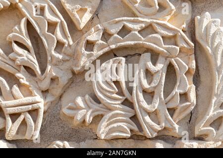 Cordoba, Spain -  November 1 2019: Fragment of wall with floral paterns in 10th century ruined Moorish medieval city Medina Azahara in Andalucia on No Stock Photo