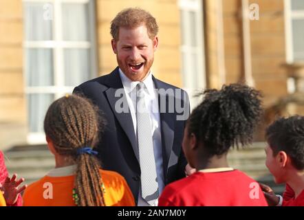 The Duke of Sussex meets children in the Buckingham Palace gardens, London, as he hosts the Rugby League World Cup 2021 draws. Stock Photo