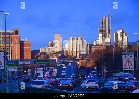 traffic jam heading into the city of Leeds at sunrise yorkshire united kingdom Stock Photo