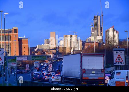 traffic jam heading into the city of Leeds at sunrise yorkshire united kingdom Stock Photo