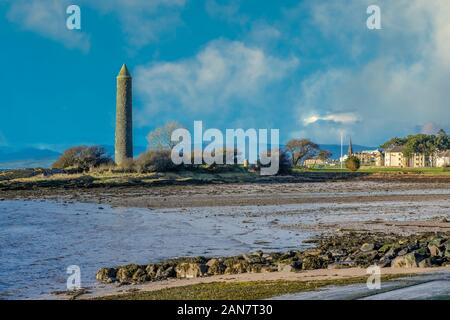 Largs foreshore looking past the Pencil Monument there to commemorate the Viking Battle of Largs in 1263. Stock Photo