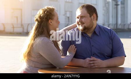 Happy couple looking at each other with love, outdoor date, tender relations Stock Photo