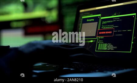 Hacker trying to pick password, server protection blocking access to information Stock Photo