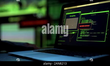 Message Access denied written on laptop screen, server blocking hacking attempt Stock Photo
