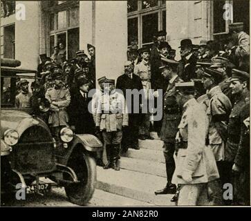 The Literary digest history of the world war, compiled from original and contemporary sources: American, British, French, German, and others . ^ spirit would be crusht. THE GERMAN DELEGATES LEAVING THE GRAND TRIANON AFTER RECEIVING THE PEACE TERMS Count Brockdorff-Rantzau, the head of the delegation, is seen at the point marked ^X, on the wall out of them by the stern but necessary conditions imposed. Howgreat would be their moral and spiritual suffering we could notknow, for the world had its doubts about the German conscience.The material hurt could more accurately be measured. They hadbecom Stock Photo