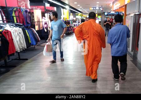 Bangkok, Thailand - December 25, 2019: Monk walking on MBK Center shopping mall Stock Photo