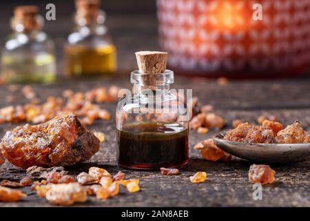 A bottle of myrrh essential oil with resin Stock Photo - Alamy