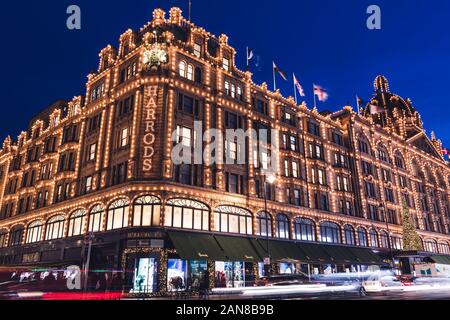 LONDON - DECEMBER 18, 2019: Harrods London department store shop at night with lights Stock Photo