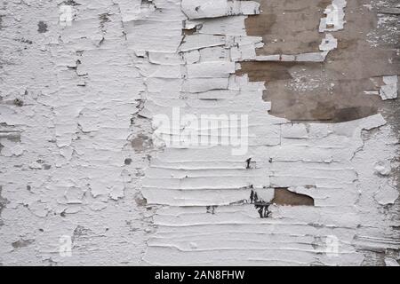 Old cracked paint on wooden wall. Cracked painted white wall. Texture or background. Stock Photo