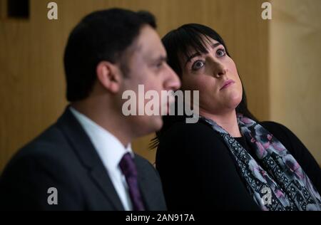 Glasgow Labour MSP Anas Sarwar with Kimberly Darroch (right), the mother of 10-year-old Milly Main who died after contracting an infection at the Queen Elizabeth University Hospital in Glasgow, during a press conference at the Scottish Parliament in Edinburgh. Stock Photo