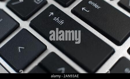 Shift and enter buttons on laptop keyboard, typing capital letters, text editing Stock Photo