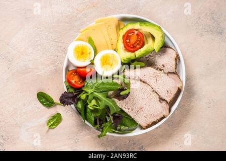 Keto diet plate on white table. Stock Photo