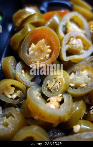 A Bowl of Sliced Green Jalapeño Chili Peppers (Capsicum Annuum) in the Buffet at the Azul Beach Resort Hotel, Puerto Morelos, Riviera Maya, Cancun Stock Photo