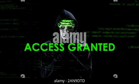 Access granted text on screen, hacker loading virus, copying secret information Stock Photo