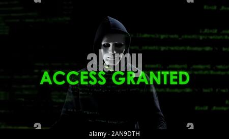 Access granted text on screen, professional hacker copying secret information Stock Photo