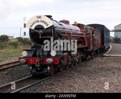 Mountain-type locomotive, Hercules, pulling a passenger train out of Dungeness Station, on the Romney, Hythe & Dymchurch Railway Stock Photo