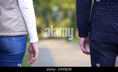 Back view of man and woman standing apart, background for statistics text Stock Photo