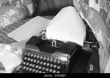 Interior with a typewriter on the table, in black and white Stock Photo