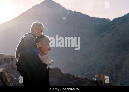 Father enjoying time with his small boy in the Atlas mountains, Morocco Stock Photo