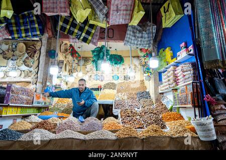 Marrakech, Morocco - January 7,2020: Arabic shop with grains, dry fruits, nuts and bags located in old town of Marrakech Stock Photo