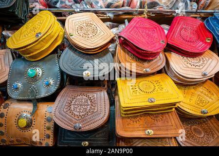 Colorful handmade leather bags sold in old town of Marrakech, Morocco Stock Photo