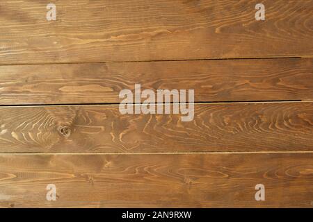 Painted wooden background with visible annual rings and knots