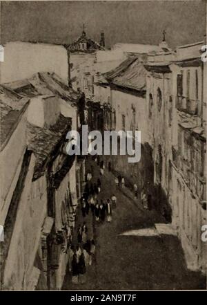 Valuable pictures by foreign and American masters . Ci ^ Cliilde Hassam, N.A. American : 1859— 1 ±—MORXIXG: SE VILLE Height, 25% inches; width, 18 inches The point of view is high above a winding street, downand into which the eye travels to find numerous peoplesauntering or gossiping in the shade, the sunlight strik-ing down from the left and defining the shadows of thehouses on that side upon the faces of those opposite.On both sides the buildings are of several stories, andthe facades are full of color, pink, pale blue, light green,red and 3ellow. Signed at the bottom, center, Childe Hassam Stock Photo