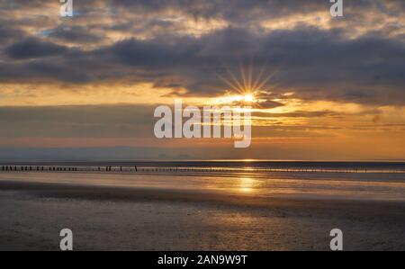 Sunset over the Bristol Channel at Brean Beach near Weston super Mare in Somerset UK Stock Photo