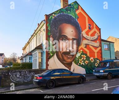 Mural of Audley Evans on the end wall of a row of terraced houses on the Seven Saints of St Pauls trail in the centre of Bristol UK