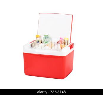 Opened red cooling box with bottles of beverage and ice isolated on white background Stock Photo