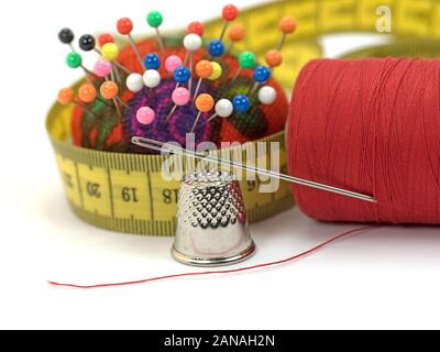 Sewing kit in a close-up against white background Stock Photo