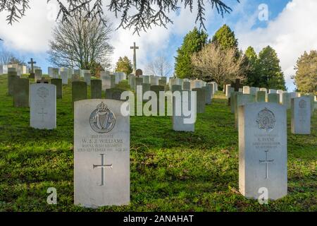 Aldershot Military Cemetery with graves of british and commonwealth servicemen and women, Hampshire, UK. First world war graves and cross of sacrifice Stock Photo