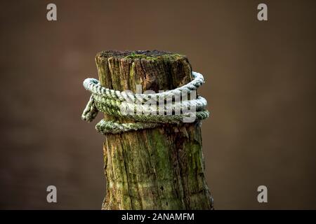 The different structures of wood and rope look really nice. Stock Photo